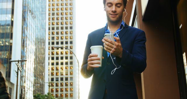 Businessman Walking in City Drinking Coffee and Using Smartphone - Download Free Stock Images Pikwizard.com