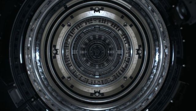 Concentric metal tunnel revealing futuristic gear core, industrial machinery symmetry
