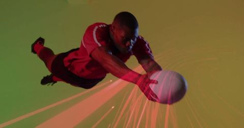 Dynamic athlete in mid-air catch with vibrant background
