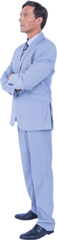 Confident Businessman Standing with Arms Crossed in Suit and Tie