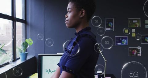 Contemplative Business Professional in High-Tech Office Environment