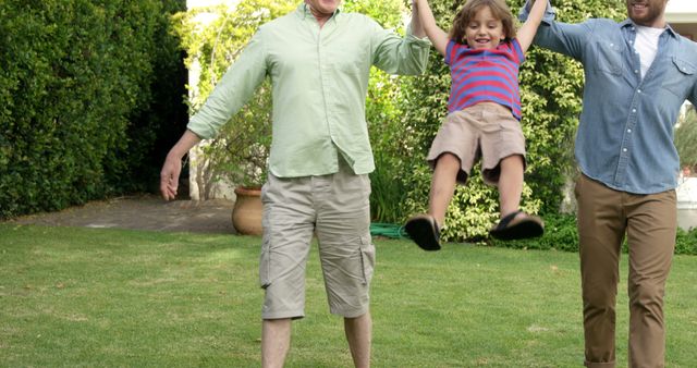 Family Enjoying Playtime Outdoors in Garden - Download Free Stock Images Pikwizard.com