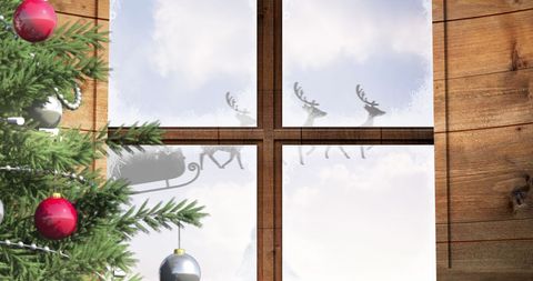 Santa and Reindeer Sleigh Through Frosted Window