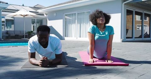 African American Couple Practicing Yoga and Core Exercises Poolside Outdoor Fitness Routine