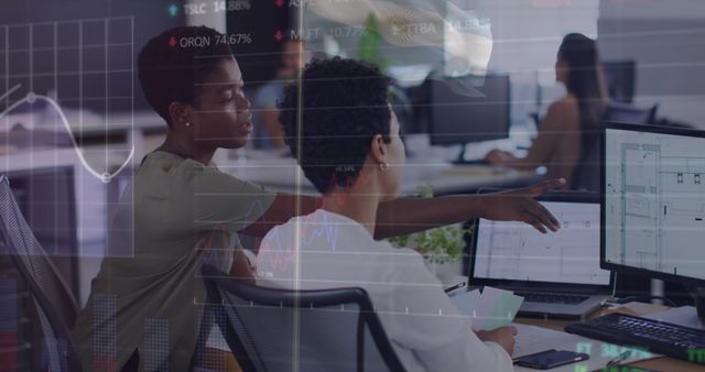 Image of statistical, stock market data processing over two diverse women discussing at office - Download Free Stock Photos Pikwizard.com