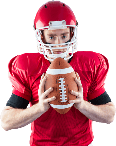 Focused football player in red uniform holding ball transparent background