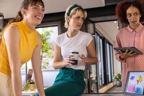 Diverse Female Coworkers Engaged in Modern Office Collaboration