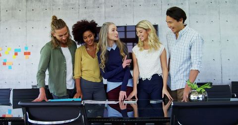 Diverse Team Discussion in Modern Office with Copy Space