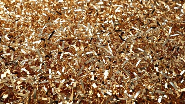 Close-up of Reflective Metallic Gold Strips Creating Luxurious Texture