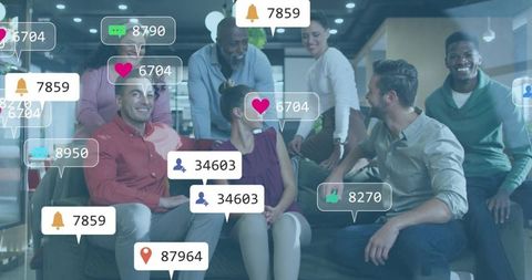 Multicultural team collaborating in office lounge with social media notifications overlay