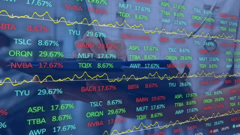 Doctor Analyzing Financial Data on Trading Screen