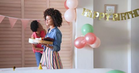 Joyful Birthday Celebration at Home with Smiling Diverse Couple