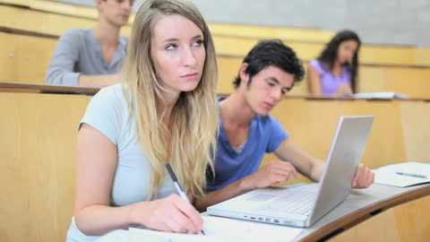 University Students Taking Notes in Lecture Hall