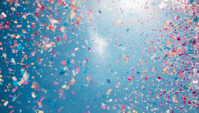 Vibrant Confetti in Blue Sky on Festive Day