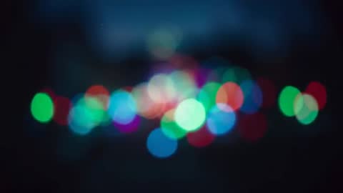 Bokeh Effect with Defocused Colorful Lights in Urban Night Scene