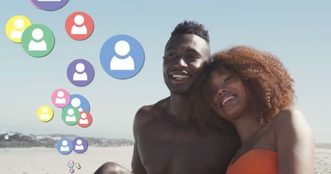Couple Smiling on Beach with Social Media Overlay