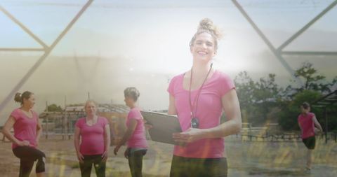 Female Fitness Coach with Women on Obstacle Course Outdoors