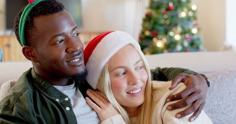Festive Couple Embracing in Cozy Living Room at Christmas