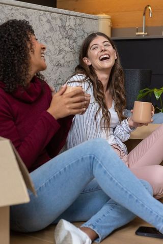 Diverse Friends Enjoying Coffee in Cozy Kitchen Setting