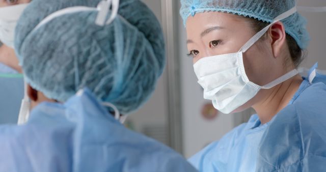 Surgeon Concentrating During Surgery in Operating Room - Download Free Stock Images Pikwizard.com