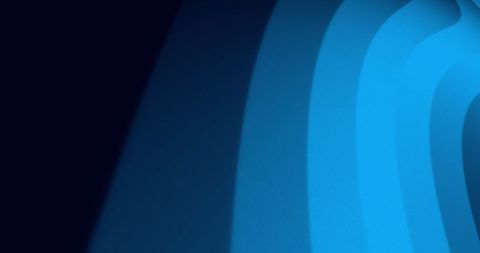 Vibrant blue light waves on dark background