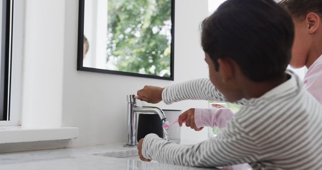 Two Children Brushing Teeth in Modern Bathroom - Download Free Stock Images Pikwizard.com