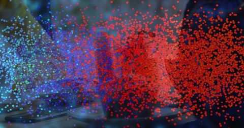 Streaming neon particle wave flowing across laptop keyboard with vibrant bokeh and motion