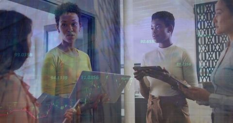 Diverse Businesswomen Discussing Finance and Technology Solutions