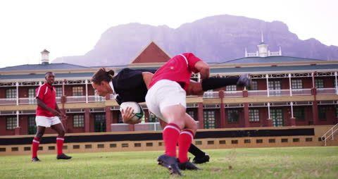 Action-Packed Rugby Players in Dynamic Tackle