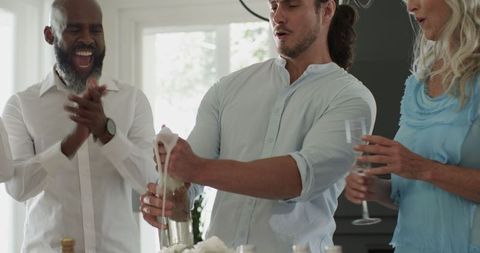 Group of Friends Celebrating Indoor Wedding with Champagne