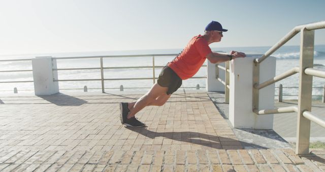 Man Exercising with Incline Push-ups Outdoors at the Seaside - Download Free Stock Images Pikwizard.com