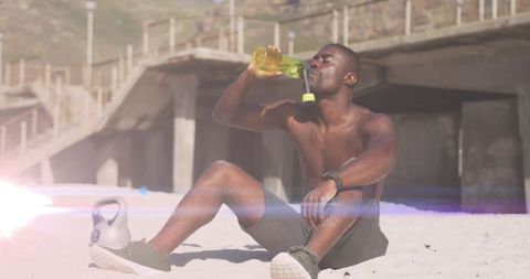 Athletic Man Drinking Water After Beach Workout