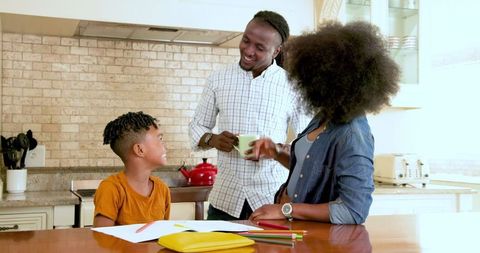 Family Bonding While Helping Son With Homework at Home