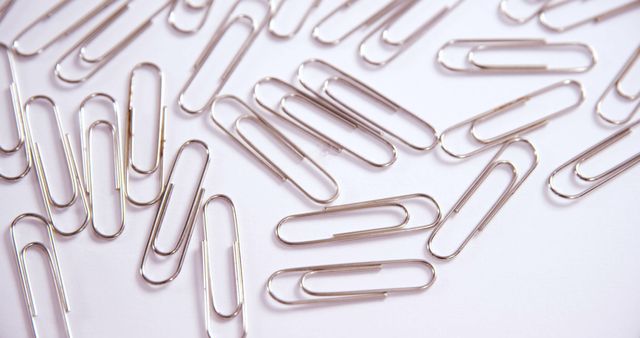 Scattered Paperclips on White Background - Download Free Stock Images Pikwizard.com