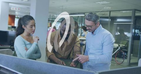 Team collaborating around laptop with augmented reality overlay in open-plan workspace