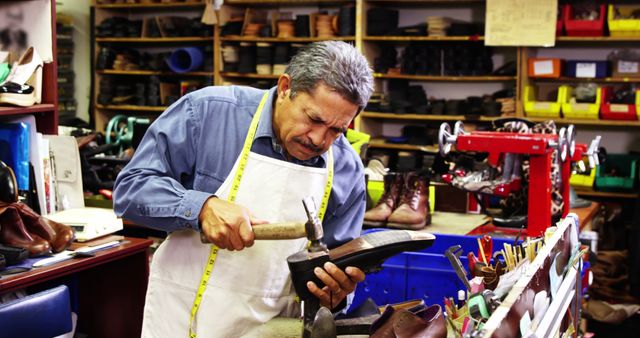 Cobbler making shoes with a hammer in workshop 4k