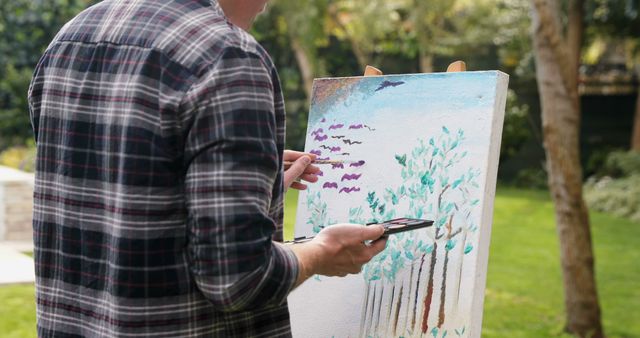Man Painting Colorful Landscape on Canvas in Outdoor Garden - Download Free Stock Images Pikwizard.com