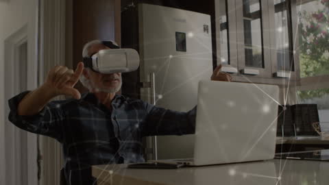 Mature Man Engaging with Virtual Reality Technology in Modern Kitchen