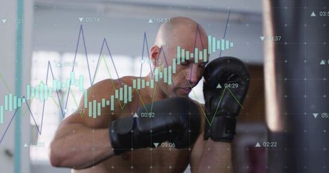 Punching boxer training with heavy bag and financial market charts overlay