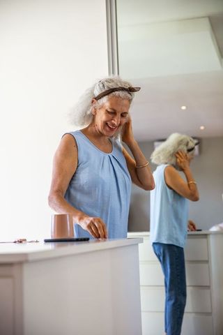 Senior Woman at Dressing Table Reflecting Serenity and Comfort
