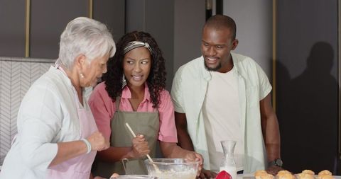 Diverse Family Baking Together in Home Kitchen