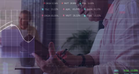 Businessman Analyzing Data on Tablet with Financial Graphics Overlay