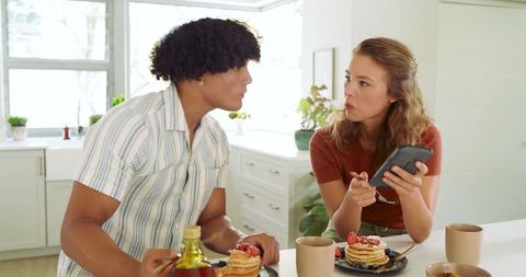 Young Diverse Couple Enjoying Romantic Breakfast Together