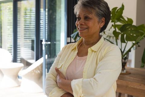 Smiling Senior Woman in Modern Bright Home