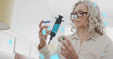 Senior woman inspecting prescription bottle with syringe icon for medication safety