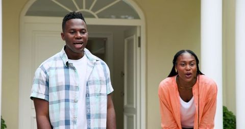 Parents Admiring Daughter's First Bike Ride Outdoors