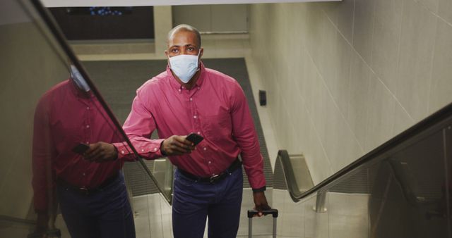 Businessman Wearing Mask Using Escalator with Luggage - Download Free Stock Images Pikwizard.com