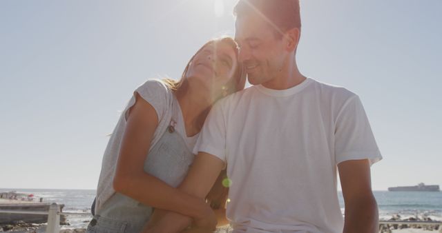 Happy Couple Embracing by the Ocean at Sunset - Download Free Stock Images Pikwizard.com