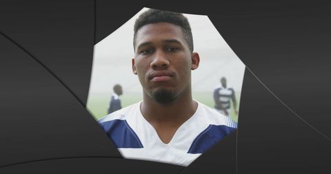 Focused Rugby Player Portrait Amid Abstract Black Shapes