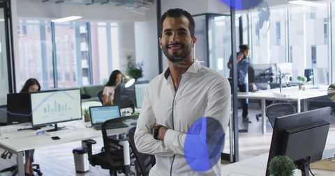 Confident Businessman Smiling in Modern Office with Digital Data Visualization
